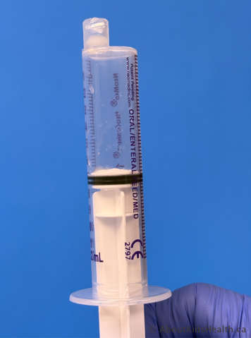 Clear oral syringe emptied of liquid and with no medication residue