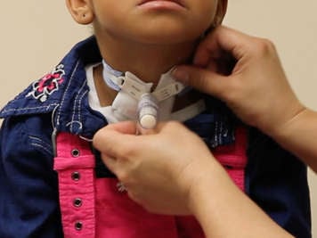 Replacing the tracheostomy dressing.