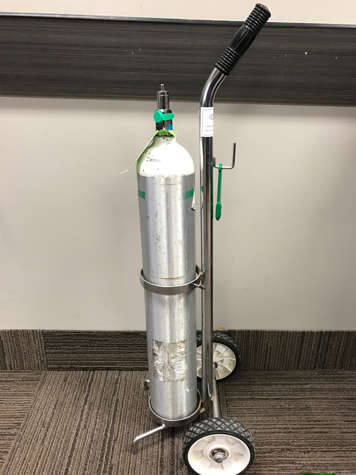 A portable oxygen cylinder or tank