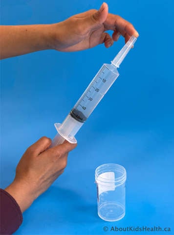 capped syringe with tobramycin mixture