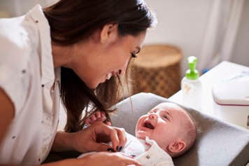 Mother and baby looking at each other and smiling