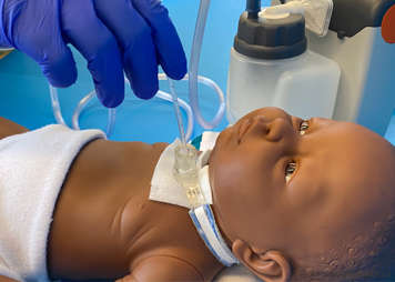 Suctioning a tracheostomy tube