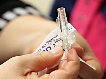 Opening a tracheostomy suction catheter package