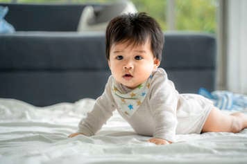 Baby pushing up on extended arms